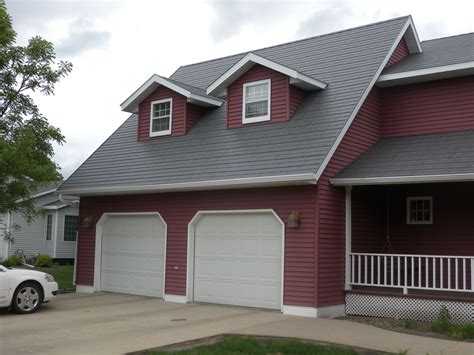 dark grey house with oxblood metal roof|gray house with metal roof.